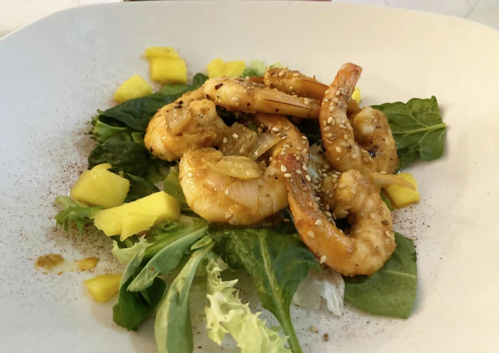 Prawns marinated in garlic, ginger, chilli & soya sauce served with spinach & mango - May 2023