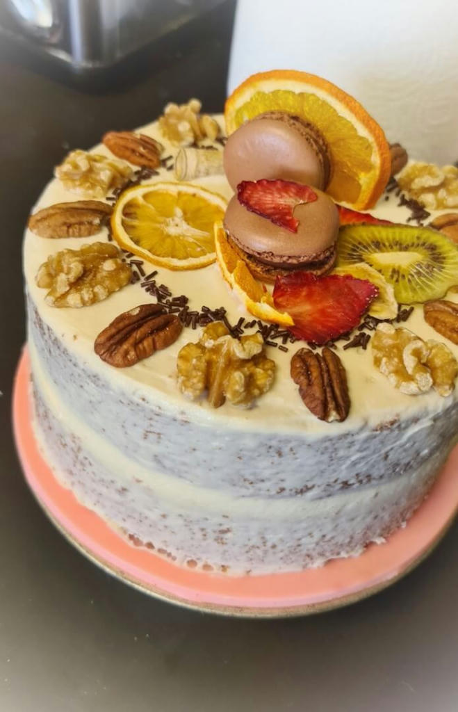 A vanilla sponge filled with homemade tangy jam and vanilla buttercream. Decorated this time with dried fruits, nuts and macarons.