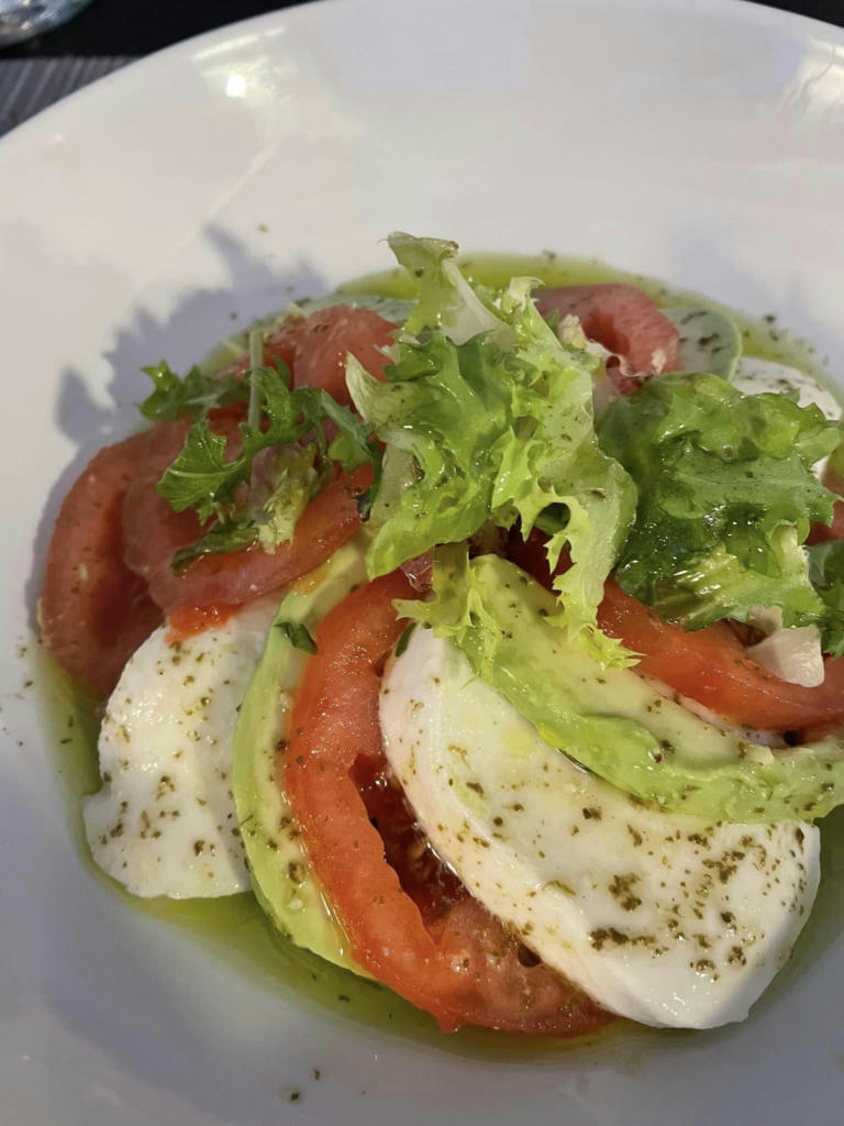 Tomato, avocado and mozzarella salad with basil olive oil - September 2023